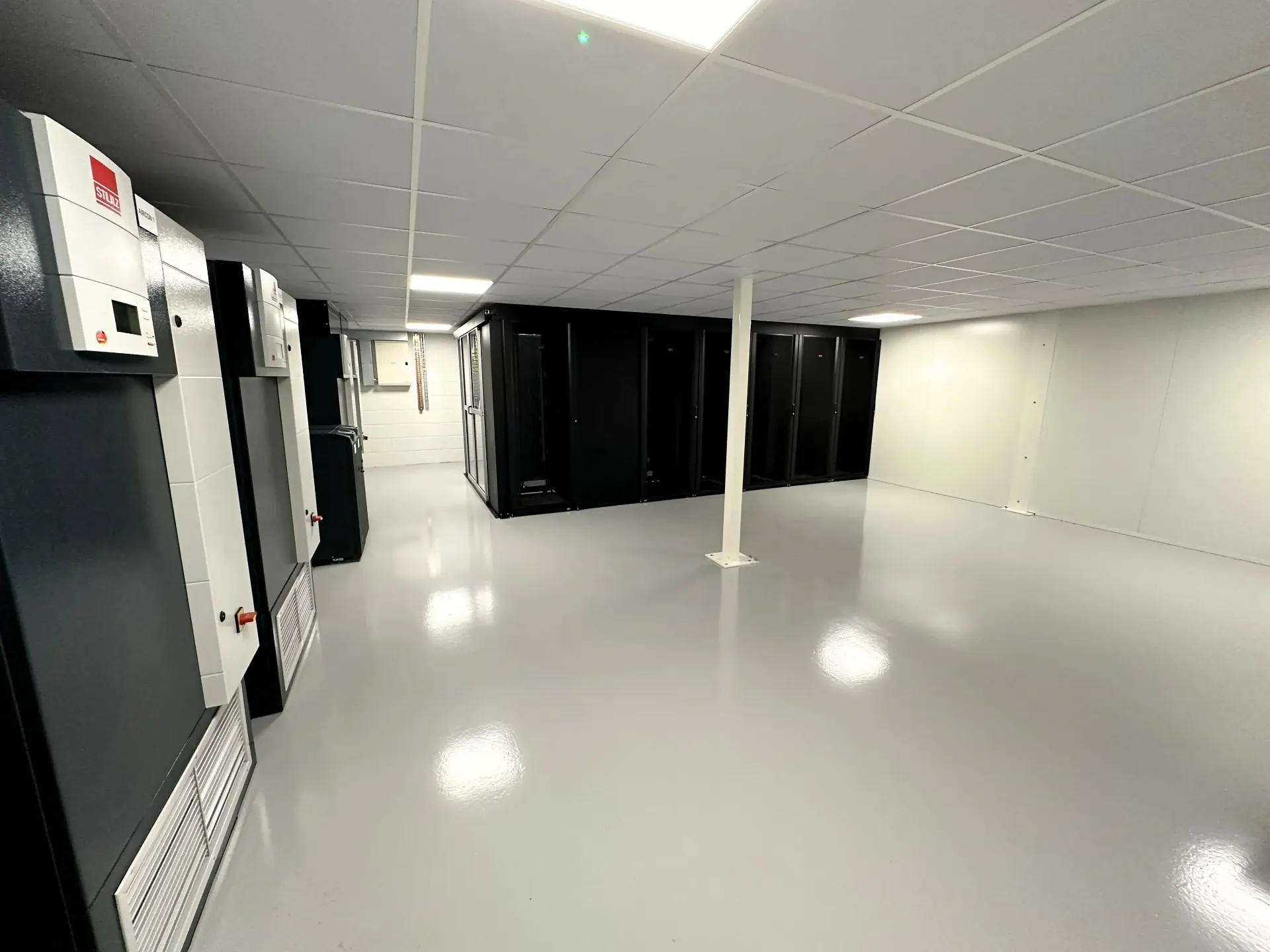 Rows of colocation cabinets in the Fast2host Cambridge Tier III data centre